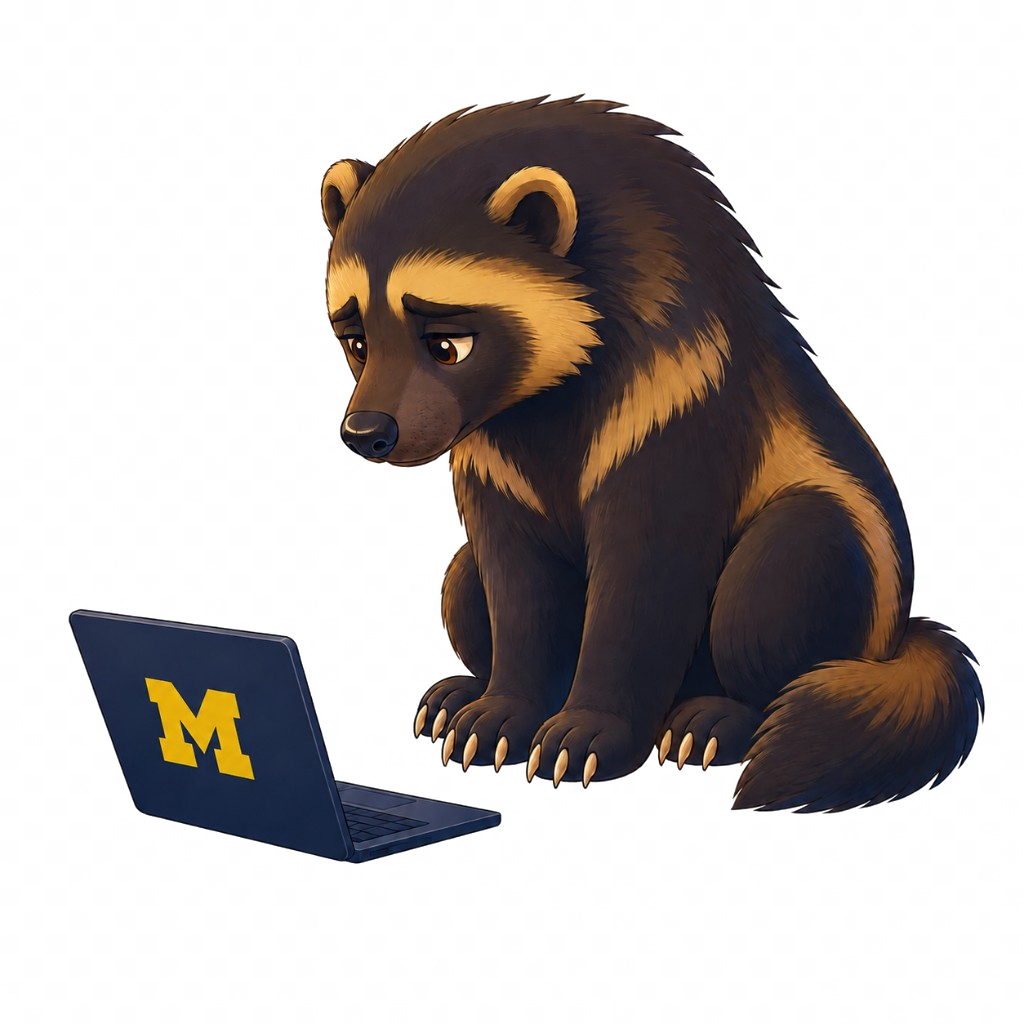 A University of Michigan wolverine looking sadly at a laptop